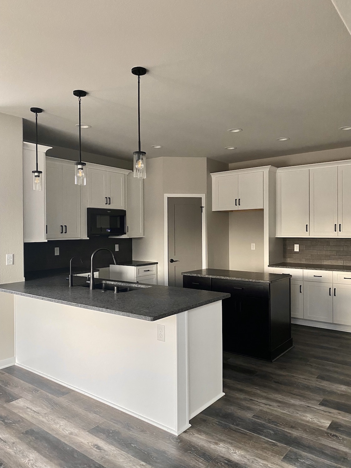 belman home builder new kitchen black and white palette 